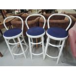 A set of three painted bentwood bar stools