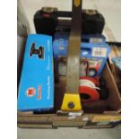 A selection of car accessories including tyre chains and wheel lock