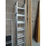 A set of triple aluminium extendable ladders
