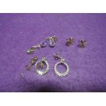 Four pairs of yellow metal and 9ct gold stud earrings of various designs