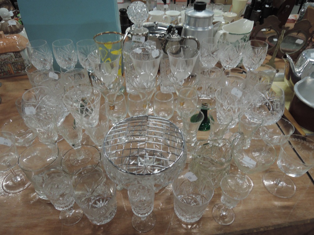 A selection of clear cut crystal glass wares including claret decanter