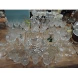 A selection of clear cut crystal glass wares including claret decanter