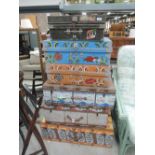 A selection of tin boxes/trunks, including painted and beer label decoration