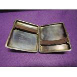 A silver cigarette case of plain form bearing inscription to inside, Chester 1917, Cohen & Charles
