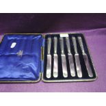 A cased set of silver handled butter knives, Sheffield 1912, John Sanderson