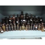 A selection of brown glass advertising bottles including Big Tree