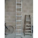 A set of folding metal ladders