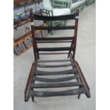 A dark stained Ercol chair frame