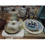 A selection of ceramic display plates and stainless tea wares