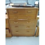 A mid Century Gomme style golden oak chest of five drawers