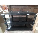 A black glass TV stand