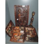 A selection of wooden shop scene dioramas and carved plaque