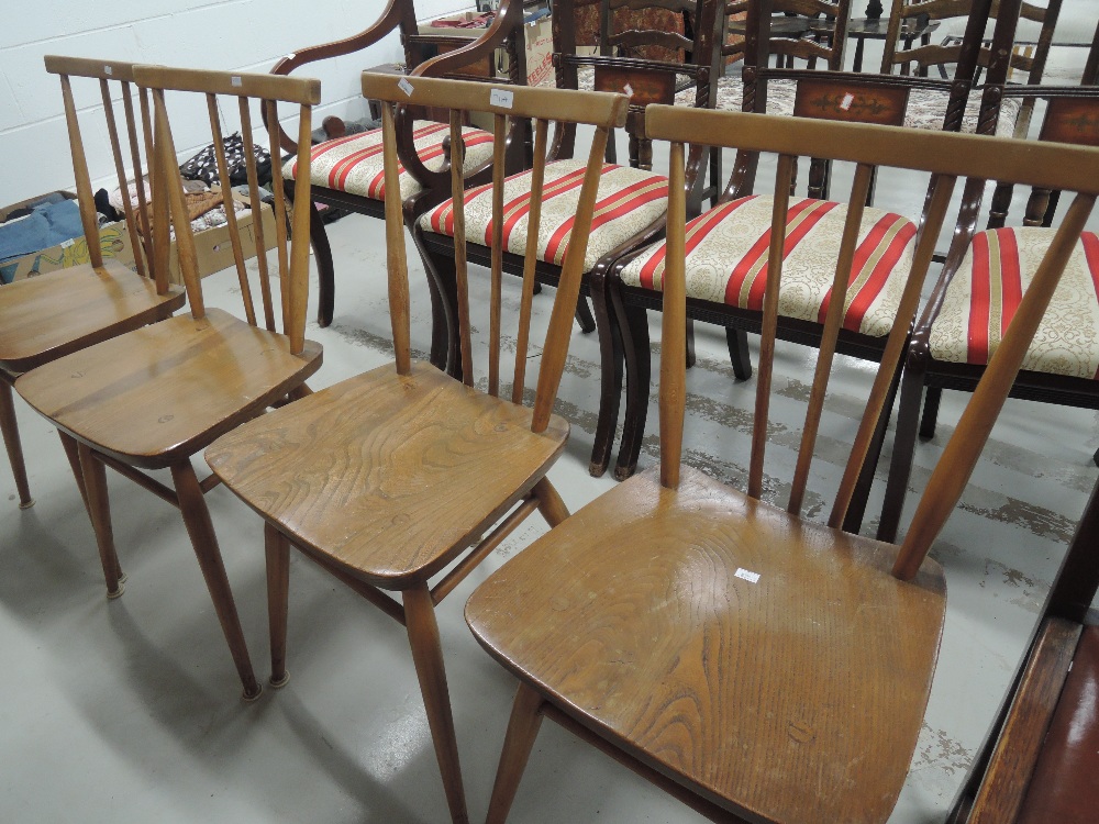 A set of four Ercol stick back kitchen chairs