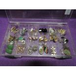 A box containing a selection of clip back earrings