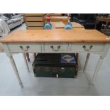 A modern pine top and painted console table