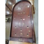 A vintage bagatelle board