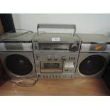 A Sanyo stereo boom box cassette player