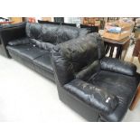 A vintage black leatherette three piece suite comprising 3 seater settee and two chairs