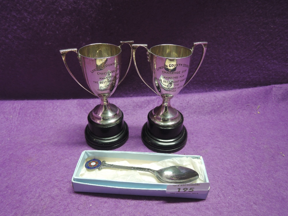 A pair of HM small silver trophies of urn form having presentation inscriptions regarding 'the