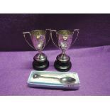 A pair of HM small silver trophies of urn form having presentation inscriptions regarding 'the
