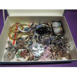 A box containing a selection of costume jewellery including Italian mosaic pendant, bangles, agate