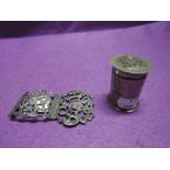 An HM silver pepperette on cylindrical form and an HM silver buckle part having pierced decoration