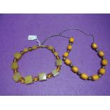 Two amber style necklaces