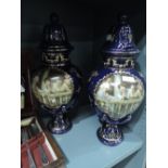 A pair of lidded mantle urns by Royal Limoges