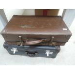Two leather bound suitcases