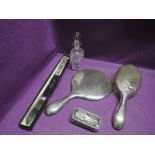 A selection of HM silver including dressing table brush, mirror and pot, bread knife and cut glass