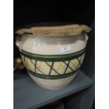 A large earthen ware lidded grain or food bin