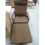 A vintage Guy Rogers chair and foot stool/coffee table