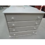 A modern painted chest of four long drawers