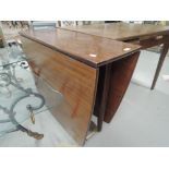 A vintage sapele drop leaf table