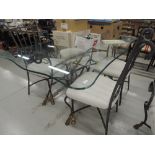 A metal and glass dining table and six (four plus two) dining chairs