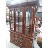A reproduction display cabinet with cupboard and drawer base
