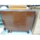 A Mid 20th Century flame mahogany gate leg table