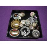 A small selection of costume jewellery brooches, including ceramic and wooden, a pendant watch and a