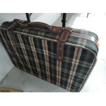 A tartan suitcase by Shilton