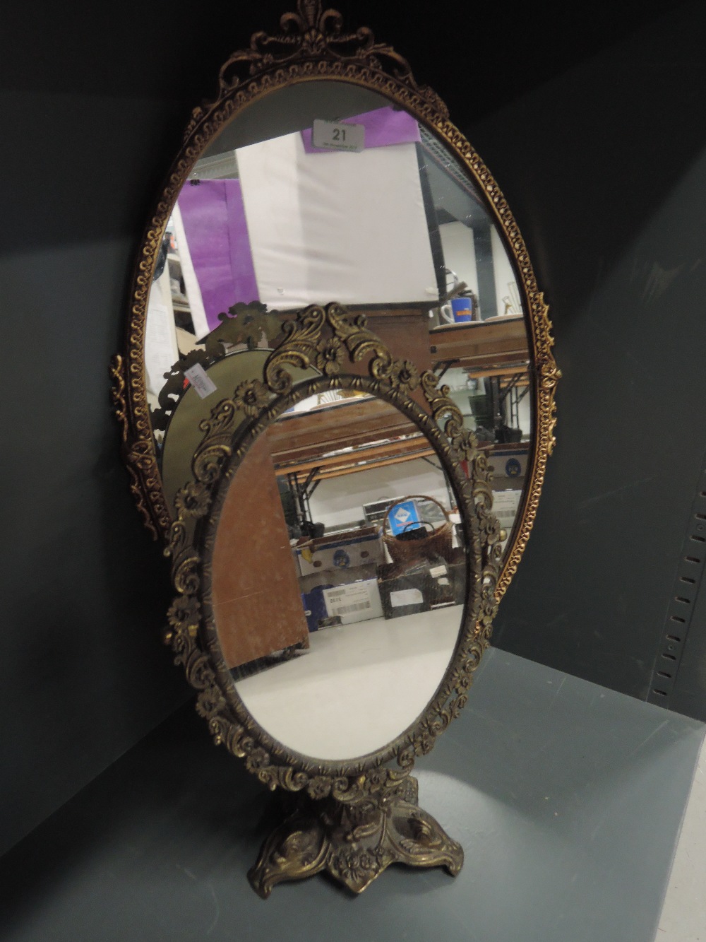 Two brass framed and base mirrors