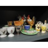 A selection of egg cups and chicken figures