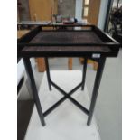 A black stained side table or tray