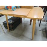 A modern beech effect dining table