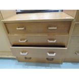 A mid Century Gomme style golden oak chest of four drawers