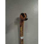 A hand carved Silver birch walking stick with badger head handle