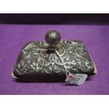 A Victorian silver mounted rocking blotter having moulded bird, scroll and mask decoration and