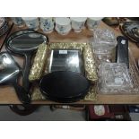 A selection of dressing table items including ebony mirror sets and pressed glass