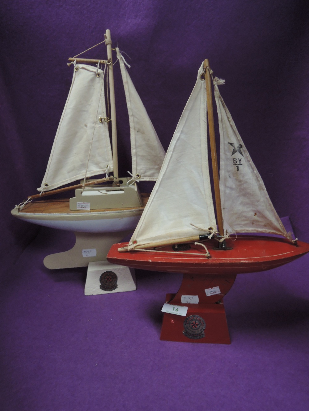 Two vintage child's toy boats the Star Yacht