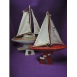 Two vintage child's toy boats the Star Yacht
