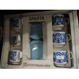 A boxed tea cup and saucer set by Tamis Sparta